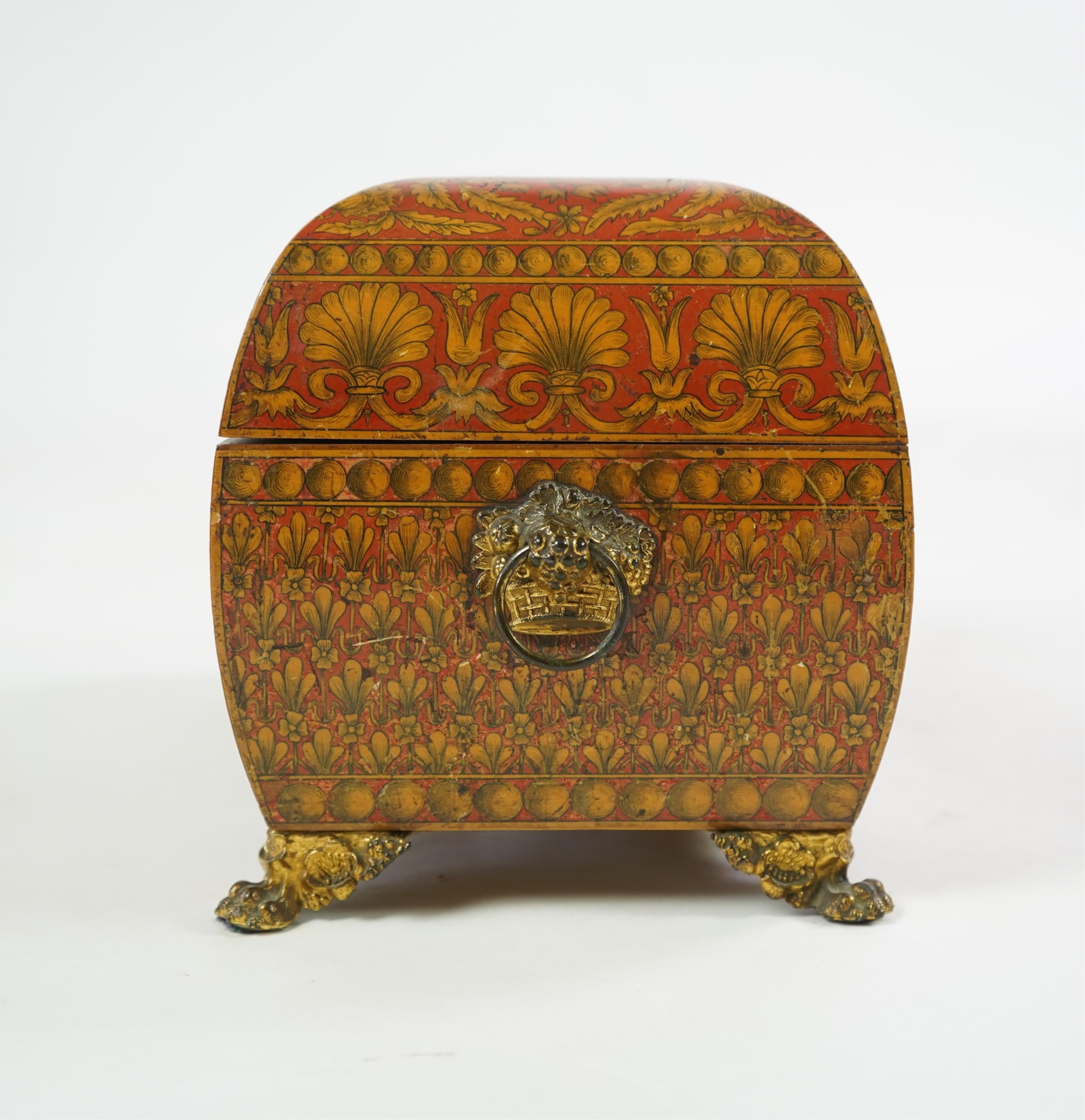 A Regency red lacquer penwork tea caddy